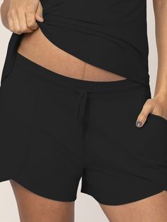 Meet the lightweight lounge shorts perfect for warm weather (or hot flashes!). Made of premium, breathable bamboo fabric, these shorts are soft, stretchy, and oh-so-comfy. Wear these maternity shorts under your bump while pregnant or at your waist postpartum. Premium, breathable bamboo Adjustable drawstring waistband Ideal for pregnancy and postpartum Decorative front seams Mom-friendly pockets! Complete the set! Pairs well with our Bamboo Nursing and Maternity Tank Top. Delivery Gown, Comfy Wear, Maternity Tank Tops, Bamboo Pajamas, Pregnancy Wardrobe, Pajama Dress, Maternity Shorts, Hot Flashes, Lounge Shorts