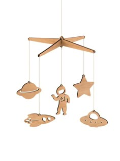 a wooden mobile with an astronaut and stars hanging from it's sides on a white background