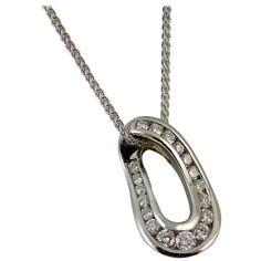 Modern Diamond Multi-Stone Pendant, White Gold, Spiga Link Chain | From a unique collection of vintage Pendant Necklaces at https://www.1stdibs.com/jewelry/necklaces/pendant-necklaces/. Exquisite Oval Diamond Necklace With Accents, Oval Diamond Necklace With Polished Finish, Oval Hallmarked Diamond Necklace In Fine Jewelry Style, Hallmarked Oval Diamond Necklace In Fine Jewelry Style, Exquisite Oval Diamond Necklaces, Exquisite Oval Necklace With Single Cut Diamonds, Luxury Oval Diamond Necklace With Polished Finish, Formal Oval Necklace With Single Cut Diamonds, Luxury Oval Platinum Necklaces