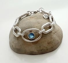 silver bracelet for woman unique design Swarovski crystal aquamarine  lobster closure very safe sterling silver plated high quality elegant and casual you can wear it every day large sizes available Silver Oval Chain Bracelet Gift, Sterling Silver Oval Bracelet, Silver Oval Chain Bracelet For Gift, Silver Gemstone Chain Bracelet, Silver Gemstone Chain Bracelet Gift, Modern Silver Bracelets With Gemstones, Adjustable Silver Oval Chain Bracelet, Adjustable Silver Blue Topaz Jewelry, Adjustable Oval Silver Chain Bracelet