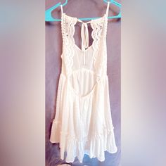 White Babydoll Dress - Perfect For Any Occasion! Lightweight Fabric But Not See-Through, Double Lined! Super Feminine And Flowy! Size: Xs Feel Free To Make An Offer Cute Vacation Dresses With Lace Trim, Cute White Lace Mini Dress, Cute Sleeveless Sundress With Lace Trim, Cute Sleeveless Mini Dress With Tie Back, Cute Tie Back Beach Dress, Cute Beach Dress With Tie Back, Cute Flowy Sundress For Beach, Cute Flowy Beach Sundress, White Bohemian Sundress With Tie Back