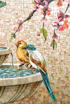 two birds are sitting on the edge of a water fountain with flowers in the background