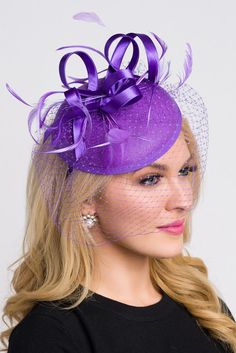 Be the envy of the party in this elegant felt fascinator. The round felt base is covered with satin ribbon loops, adorned with flighty feathers and topped off with a birdcage veil. This gorgeous piece is perfect for any special occasion. - Easy wear headband - Optional; tuck-a-way veil - Available in several other colors Purple Veil, Felt Fascinator, Purple Hat, Purple Hats, Birdcage Veil, Bird Cage, Easy Wear, Satin Ribbon, Fascinator