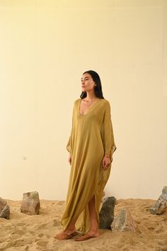 Jara Kaftan Raw Silk Gauze This handcrafted garment is made slowly with artisan techniques. Each piece is unique. One Size Care |  Dry clean or hang in soft sunlight or breeze to freshen. Please see care label Silk Tunic Kurta For Summer, Bohemian Long Sleeve Gold Kaftan, Gold Bohemian Long Sleeve Kaftan, Gold Long Sleeve Bohemian Kaftan, Summer Silk V-neck Kurta, Bohemian Gold Maxi Dress With Long Sleeves, Long Sleeve Silk Beach Dress, Bohemian Silk Long Kaftan, Bohemian Silk Long Kaftan Dress