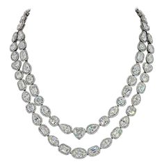 A beautiful example of how fancy shapes can really create a statement piece of jewelry is this diamond necklace by William Goldberg. Designed as a two-row swag of Ashoka [brand name for a round-cornered rectangular modified-brilliant cut], cushion, marquise, circular, pear, rectangular, oval, and heart-shaped diamonds, each within a circular-cut diamond surround... and mounted in platinum. GIA quality analysis: 48 of the diamonds were graded by GIA. Exceptional sparkle and brilliance! Total carat weight of all diamonds: 63 cttw. Center diamonds range from 1 to 2 carats each. Length: drops to 17 inches. Dutch Hat, Necklace Design Ideas, Diamond Infinity Necklace, Diamond Drop Necklace, Marquise Shape Diamond, Retro Bracelet, David Webb, Expensive Jewelry Luxury, Diamond Necklace Set