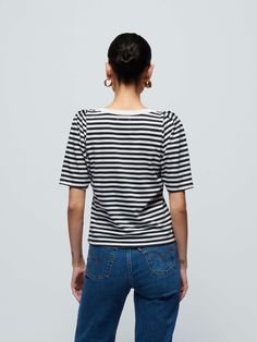 We elevated your everyday tee with delicate feminine details. (It's the easy envelope neckline and chic pleats on the shoulders.) Same boxy short sleeves and relaxed fit you love, but now polished enough to wear to work. (This one comes in black and white City Stripe.) | Women's Deana Tee Top in City Stripe | Ethical Essentials Chic T-shirt For Casual Gatherings In Summer, Chic T-shirt For Casual Summer Gatherings, Chic Fitted Top T-shirt For Day Out, Classic Short Sleeve Top For Everyday Summer Wear, Classic Short Sleeve Top For Summer, Chic Cotton Short Sleeve Top For Everyday, Chic Short Sleeve Top For Casual Gatherings, Chic Relaxed Fit Short Sleeve Top, Chic Short Sleeve T-shirt For Day Out