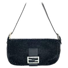 Fendi Baguette Vintage Black Glitter Beads Shoulder Bag Discover the Fendi Baguette Vintage Black Glitter Beads - a masterfully crafted, iconic design enhanced with shimmering beads. This exquisite piece of art is versatile and can elevate any outfit, making it a timeless addition to your wardrobe. CONDITION: VERY GOOD This vintage preloved Fendi baguette is in very good condition with minimal signs of wear. Most beads are in tact, and there are a few scratches on the leather of the flap. DETAIL Fendi Baguette Vintage, Fendi Vintage, Vintage Fendi, Fendi Baguette, Outfit Making, Iconic Design, Black Hardware, Black Glitter, Fashion Handbags