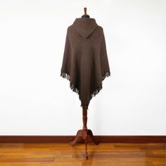 Introducing our exclusive unisex poncho, meticulously handcrafted from the finest llama wool yarn. This poncho is not just a garment; it's a blend of tradition and comfort. Its lightweight yet warm nature makes it an ideal choice for various settings. Key Features: Size: One Size, Approximately 48" Width x 43" Height / 122 cm Width x 110 cm Height, including fringe. Craftsmanship: Each poncho is a unique creation, handwoven by skilled indigenous artisans. Texture: soft to the touch, ensuring no Cheap Brown Poncho One Size, Casual Brown One-size Poncho, Bohemian Hooded Alpaca Poncho, Cozy Brown Alpaca Poncho, Poncho With Hood, Beige Alpaca One-size Poncho, Wool Yarn, Llama, One Size Fits All