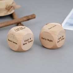 two wooden dices sitting next to each other on a table