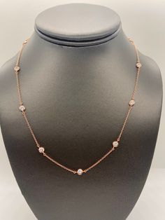 "Trendy Diamond By The Yard Necklace made of 925 sterling silver with a high polish rhodium or 14K rose gold over. It features high quality bezel set simulated diamonds (CZ) every 1.5\" throughout. Rhodium (silver)- 18\" adjustable to 16\" & 17\" Rose Gold- 18\" only- NOT adjustable How to care for your gold plated sterling silver jewelry: To clean your gold plated jewelry, use a soft cotton ball or a very soft cloth to remove any dust or dirt. This will clean and restore shine to your piece. On Luxury Diamond Necklace With Satellite Chain, Gold Chain With Diamond Balls, Elegant Diamond Chain Necklace, Tarnish Resistant, Classic Diamond Station Necklace, Formal Gold-plated Diamond Necklace With Adjustable Chain, Dagger Earrings, Silver Diamond Necklace, Picture Pendant, Ball Chain Necklace