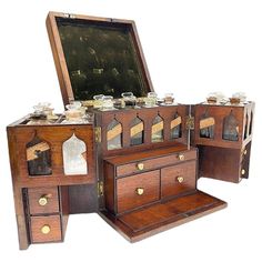 three wooden drawers with glass jars on them