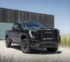 a black truck parked in front of a building