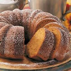 a bundt cake sitting on top of a wooden plate