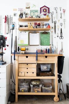 a workbench with lots of crafting supplies and tools on it's shelves