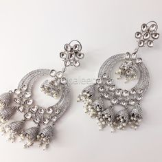 Stylish and exquisite ethnic - South-Asian - Indian - Punjabi - Pakistani - silver uncut polki chandabaali earrings Celebrity silver jhumka Bollywood jewellery long silver chandbaali earrings Jadau cocktail earrings. Perfect gift for Mother's day. Length: 12.5 cms  Width: 5.5 cms  Weight: 102 grams GIFT / PERSONALISED MESSAGE: Please provide the message within the NOTE TO SELLER section if you want to send this item with a GIFT/PERSONALISED MESSAGE CARD. We will follow the instructions and ship Silver Metal Chandbali Bridal Earrings, Silver Kundan Dangle Jewelry, Elegant Silver Kundan Chandelier Earrings, Heavy Silver Metal Chandbalis, Festive Silver Chandelier Earrings With Tilla, Silver Chandbali Chandelier Earrings, Silver Kundan Chandelier Dangle Earrings, Silver Metal Chandbalis For Wedding, Silver Kundan Fusion Danglers