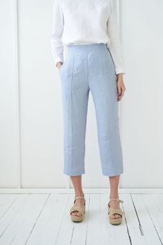 "TORI - finest pair of classic linen pants with a flat front for a polished look. FABRIC: 100% softened Lithuanian linen COLOR: Please choose a color on the side menu. STYLE: Cropped linen flat front pants with rubber at the back and side pockets. SIZE CHART (body measurements) : S Bust 31.5- 35\" (80- 88 cm) Waist 23- 26.5\" (59- 68 cm) Hips 35- 38\" (88- 96 cm) M Bust 35- 38\" (89- 96 cm) Waist 27- 30\" (69- 76 cm) Hips 38- 41\" (97- 104 cm) L Bust 38- 41\" (97- 104 cm) Waist 30.5- 33\" (77- 8 Cotton Bottoms In Flax Color For Workwear, Linen Bottoms With Straight Hem For Workwear, Linen Pants With Welt Pockets And Straight Hem, Flax Cotton Pants For Workwear, Flax Cotton Pants For Work, Tapered Leg Flax Pants For Work, Flax Tapered Leg Pants For Work, Spring Flax Pants With Pockets, Blue Linen Bottoms For Work