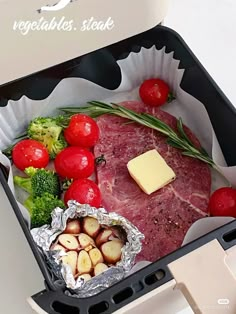 meat, vegetables and potatoes in a container on a white counter top with the words vegetables steak written above it