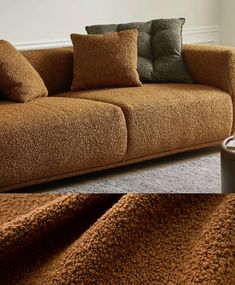 a brown couch with pillows on it and a coffee cup next to it in front of the couch