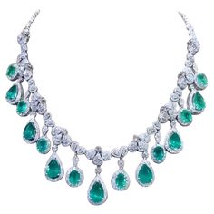 A magnificent piece of Italian art , a very fabulous design, sophisticated and refined, a glamour and fashion collection, perfect for elegant ladies. Necklace come in 18k gold with 7 pieces of natural Zambian Emeralds in pear cut of 20,75 carats , fine quality, amazing color, CEO Minor, and 8 pieces of natural Zambian Emeralds in oval cut of 15,44 carats, fine quality, spectacular color , CEO Minor , and 763 pieces of natural diamonds in special cut of 20,55 carats, F color VS clarity, very sparkly . Piece of high jewelry. Handcrafted by artisan goldsmith. Excellent manufacture and quality. Complete with AIG certificate. Whosale price. Note: on my shipment, no taxes. Ladies Necklace, 18k Gold Necklace, Elegant Ladies, Zambian Emerald, Italian Art, Gorgeous Jewelry, Dream Jewelry, High Jewelry, Zambia