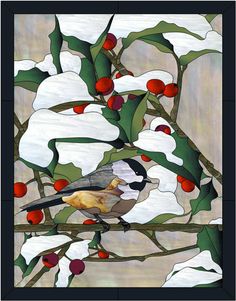 a bird perched on top of a tree filled with snow covered branches and berries in front of a stained glass window