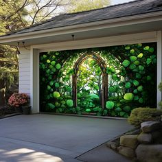 a garage door with a painting on the side of it and trees in the background