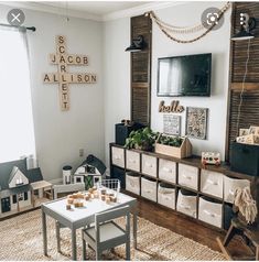 a living room filled with lots of furniture and decor on top of a hard wood floor