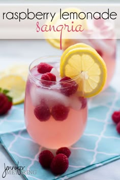 raspberry lemonade sangria in a glass with fresh raspberries