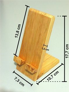 a small wooden stand with measurements for the top and bottom pieces on it's sides