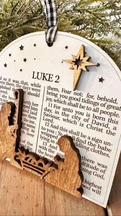 a wooden ornament hanging from a christmas tree