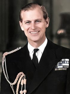 a man in uniform is smiling for the camera