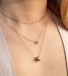 "Personalized 14K solid gold upper case initial necklace is a signature, timeless piece. This version is covered colorful natural green emeralds. The chain is adjustable from 16\" to 21\" long, featuring a spring clasp closure. The necklace is entirely 14K gold and the initial can be personalized. Just leave your preferred initial at checkout. Details: - 14K solid gold - The initial is 8mm - ..23ct of natural green emerald - Available in white, yellow, and rose gold and length from 14\" to 21\" Fine Jewelry Initial Necklace With Cable Chain, Luxury Charm Necklaces With Cable Chain For Gift, Luxury Charm Necklace With Cable Chain As A Gift, Fine Jewelry Gold Emerald Necklace With Delicate Chain, Luxury Cable Chain Charm Necklace As Gift, Gold Emerald Necklace With Delicate Chain, Fine Jewelry, Luxury Cable Chain Charm Necklace, Yellow Gold Emerald Necklace With Chain For Gift, Dainty Gold Emerald Necklace For Formal Occasions