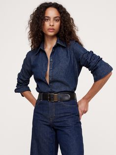 Our signature oversized shirt is cut with especially high slits at the sides to show off high-waisted styles.  Here, we opted for a soft denim fabric that's specially woven to deliver rich, authentic washes in a weight that's suitable for layering through all seasons.  Oversized fit.  Point collar with button-front closure.  Long cuffs.  Unlined.  Oversized.  Long sleeves.  Hip length.  Model: Size S, 5'10" (178cm). Jeans With Button Up Shirt, Dark Denim Shirt Outfit, Denim Shirt Outfit, Denim Outfit Men, Oversized Denim Shirt, Denim Shirt With Jeans, Denim Outfits, High Waist Fashion, Denim Trends