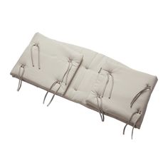 a white bench cushion with ties on it