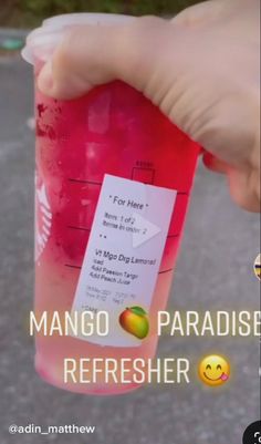 a person holding a plastic cup with liquid in it and the caption reads mango paradise refresher