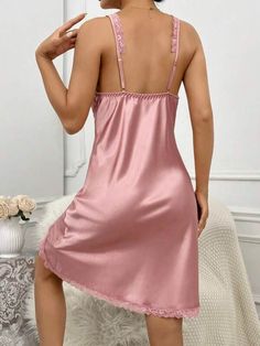 Elevate your evening elegance with our Lace Trim Satin Cami Nightdress. Delicately designed with a charming bow and exquisite contrast lace, this slip dress exudes timeless allure. Its sleeveless silhouette and comfortable regular fit are ideal for a restful night's sleep. Crafted from luxurious satin, its non-stretch fabric ensures durability. This nightdress is washable with gentle hand wash. Features: Details: Bow, Contrast Lace, Split Type: Slip Dress Sleeve Length: Sleeveless Length: Short Sleeveless Lace Nightgown For Party, Sleeveless Lace Party Nightgown, Feminine Sleeveless Slip Dress For Wedding Night, Feminine Lace Patchwork Dresses For Night, Summer Night Dresses With Contrast Lace, Summer Night Dress With Contrast Lace, Sleeveless Delicate Lace Sleepwear For Party, Lace Bodice Nightgown For Loungewear, Sleeveless Party Nightgown With Delicate Lace