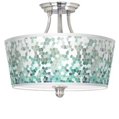 a semi flush light fixture with green and white mosaic glass shades on the drum shade