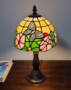 a stained glass lamp on a wooden table