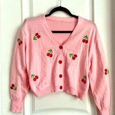 Pink Button Down Cardigan Sweater With Cherry Print Women’s Size S. Length 18 1/4 Red Buttons Cute Button-up Cardigan For Fall, Cute Button-up Fall Cardigan, Casual Spring Sweater With Button Closure, Casual Red Button-up Cardigan, Red Spring Cardigan With Button Closure, Pink Button-up Casual Sweater, Pink Casual Button-up Sweater, Red Buttoned Cardigan For Spring, Red Button-up Cardigan For Spring