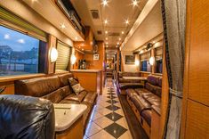 the inside of a train car with leather couches