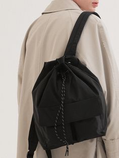 This is a comfortable and casual bag by Cord. that is made out of high quality and sturdy material. With distinctive mood of the design and comfortable wear, you can style it for your daily outfit.- Minimal logo embroidery detail- Adjustable shoulder strap length- Inner zipper pocket and dual pockets Sporty Shoulder Backpack With Pockets, Sporty Shoulder Bag Backpack With Pockets, Sporty Shoulder Bag With Pockets In Backpack Style, Black Shoulder Bag With Adjustable Strap, Black Softback Shoulder Bag With Adjustable Strap, Sporty Shoulder Bag Backpack For Daily Use, Practical Black Shoulder Bag For School, Black Softback Bags With Pockets, Versatile Black Softback Bag