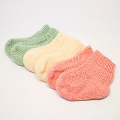 three pairs of socks sitting next to each other