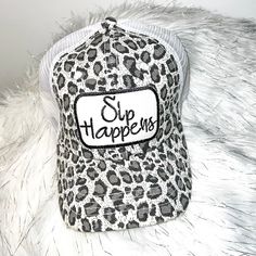 Sip Happens Distressed Trucker Hat-White Leopard Trendy White Adjustable Trucker Hat, White Mesh Visor Hat, Trendy Adjustable White Trucker Hat, White Adjustable Trendy Trucker Hat, Adjustable White Mesh Hat, White Mesh Trucker Hat One Size, White Mesh Trucker Hat For Spring, Summer White Mesh Hats, Trendy White Hat With Curved Bill