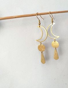 This pair is made of hypoallergenic brass parts. No Nickel and no Lead. . Light to wear and easy to combine. 🌿 . The item will arrive to you wrapped as a gift in a paper gift bag. . 》SHIPPING: If you need a tracking number for your order change the shipping option before checkout. 🌎 . If you have any questions please contact me, I usually respond quite fast 💌 . 》Please before ordering read my shop's announcement and check carefully the estimated delivery time Etsy gives you. I am only respons Brass Earrings With Sun And Moon Design For Festival, Brass Sun And Moon Design Earrings For Festival, Brass Sun And Moon Festival Earrings, Gold Moon Charm Earrings For Festival, Metal Moon-shaped Earrings For Festivals, Bohemian Gold Moon Phase Earrings, Festival Moon Shaped Brass Jewelry, Festival Moon-shaped Brass Jewelry, Festival Metal Earrings With Moon Charm