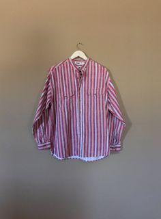 Authentic vintage long sleeve shirt with 90s stripe design. Dates from early to mid 90's. This shirt is in great condition with little signs of previous wear. Full button up front. Long sleeves can be buttoned at wrist or rolled up. Still has many years of wear left. Check out my shop 'TheBarnLadder' for reviews and feedback Measurements (taken zipped-buttoned up and laid comfortably flat) x2 for circumference Size Small Shoulders 40-42 Bust 42 Bottom hem circumference 42 Sleeve 22 Top arm circu 90s Style Relaxed Fit Button-up Top, Oversized Retro Shirt For Spring, Retro Oversized Button-up Tops, Oversized Retro Button-up Top, 90s Style Button-up Tops For Spring, Oversized Long Sleeve Retro Shirt, 90s Style Long Sleeve Summer Shirt, 90s Long Sleeve Summer Shirt, 90s Inspired Long Sleeve Cotton Top