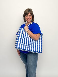 Add some serious sass to your beach game with our Summer Tote Bags. With two color options, this woven bag is the perfect accessory for a day by the water. Stay stylish and organized while carrying all your beach essentials. (No more losing your sunglasses in the sand!) Hot pink, clear, & aruba blue Blue & white Free shipping over $100. Summer Vacation Beach Bag In Plastic, Summer Vacation Plastic Beach Bag, Beach Tote Bag In Plastic, Summer Tote Shoulder Bag In Plastic, Summer Plastic Tote Shoulder Bag, Casual Beach Bags Made Of Plastic, Summer Travel Beach Bag Made Of Plastic, Summer Plastic Tote Bag, Plastic Beach Tote Bag