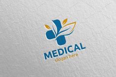 the medical logo is shown on a white paper with blue and yellow leaves in it