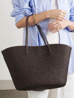 Brunello Cucinelli's tote is perfectly sized for long weekends away or days at the beach. Woven from raffia, it's trimmed with the label's signature Monili beads and has an oversized, open-top design. Use the zipped pocket to keep small essentials secure.