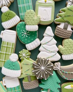 christmas cookies decorated with green and white decorations