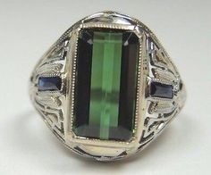 A personal favorite from my Etsy shop https://www.etsy.com/listing/463364322/antique-vintage-green-tourmaline Classic Green Tourmaline Jewelry, Antique Green Emerald Ring With Polished Finish, Antique Green Multi-stone Jewelry, Classic Green Multi-stone Sapphire Ring, Antique Green Multi-stone Ring, Art Deco Green Emerald Multi-stone Ring, Oval Green Sapphire Ring Hallmarked, Green Oval Sapphire Ring For Formal Occasions, Vintage Multi-stone Green Emerald Ring