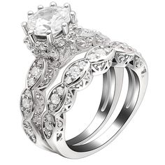 a wedding ring set with an oval cut diamond in the center and side stones on each band